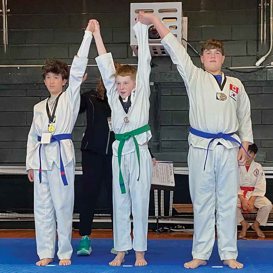 Allan Fox (middle), silver medallist for board breaking