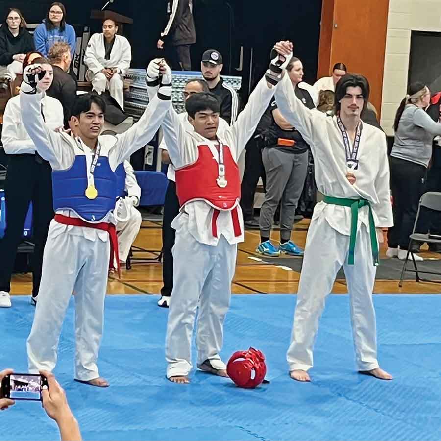 Jhames Chimicag, Gold Medallist in Sparring (left) with Kian Chimicag, Silver Medallist in Sparring (middle)