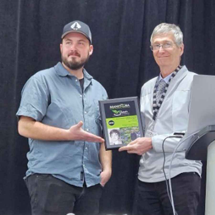 Michel Touchette (right) receives the Life Membership Award from the Manitoba Nursery Landscape Association on Feb. 19, recognizing more than four decades of leadership and innovation in Manitoba’s horticulture industry