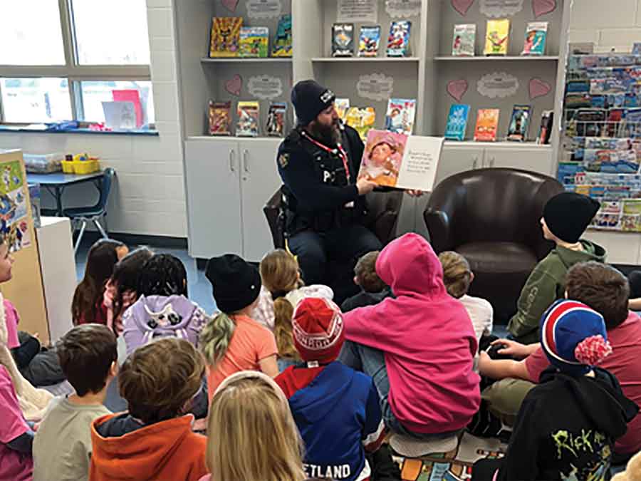 Lundar School students wrapped up I Love to Read Month with special community connections, including visits from local police officers and a reading-inspired field trip for Grade 4 students to meet their senior pen pals