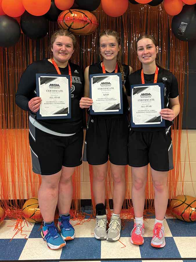 Provincial All-Star selections Lexi Jones (left) and Laila Miller (right) flank tournament MVP Kamryn Lepp following the MHSAA ‘A’ Provincial Girls Basketball Championship