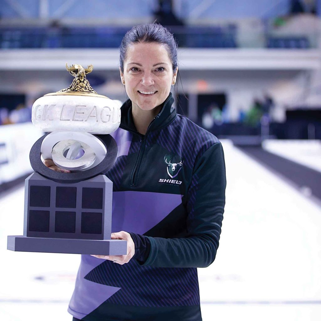 Kerri Einarson poses with the championship trophy after helping Shield Curling Club win the inaugural Rock League title in Toronto