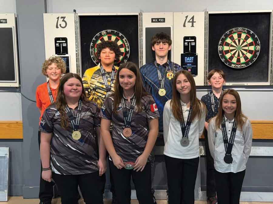 Winners of the Manitoba Darts Association youth provincial championships pose following the March 8 event. Pictured: Cassidy Sidlar, Saedie Montminy, Addison Zebinski, Parker Carmody-Vallières, Finn Fletcher, Nkosa Antoine, Sebastian Fletcher and William Caoutte. The eight players qualified to represent Manitoba at the Canadian National Darts Championship in Saint-Hyacinthe, Que