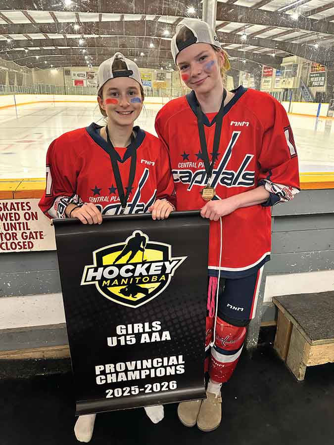 Elm Creek’s Eden Lepp and Kinsley Friesen celebrate as part of the U15 AAA championship-winning roster at the Hockey Manitoba provincials