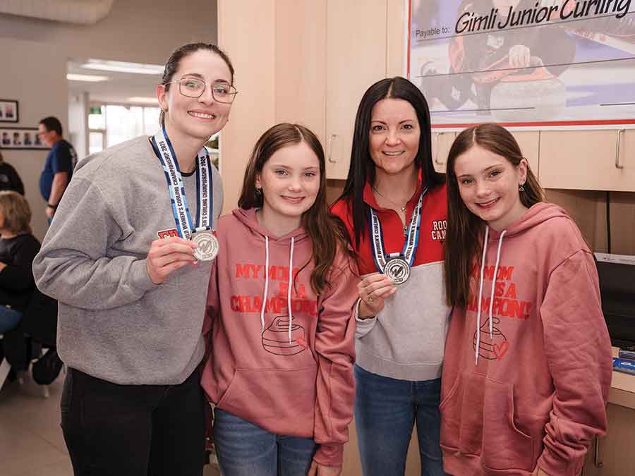 Kerri Einarson (second from right) poses with her twin daughters, Kamryn and Kloe, and teammate Shannon Birchard during a homecoming celebration at Gimli Ford on March 31. The event, supported by Lakeview Gimli Resort, honoured Einarson’s fifth Scotties title and recent silver medal at the 2026 world women’s curling championship