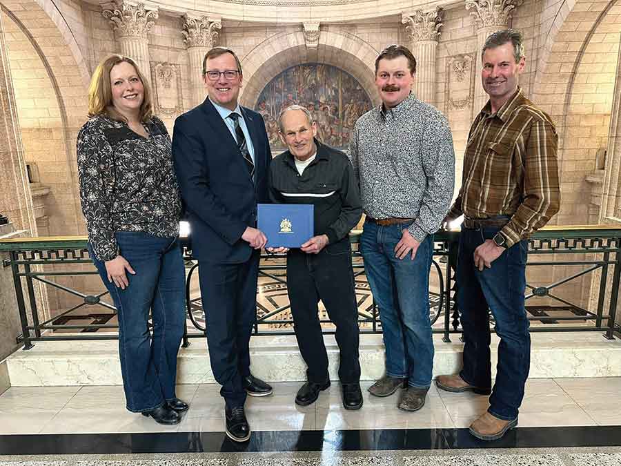 Lanna Mason, Derek Johnson, Ken Mason, Andrew Mason and Darcy Mason are pictured at the Manitoba legislature on March 14, where Johnson recognized Mason Farms for their contributions to the community
