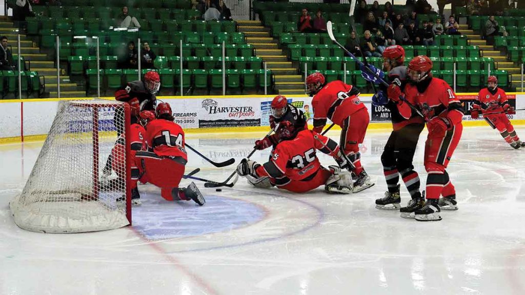 Selkirk Fishermen goaltender Marcus Sharpe scrambles outside the crease as teammates collapse to block a scoring chance from La Broquerie’s Gabriel Asselin during CRJHL championship series action
