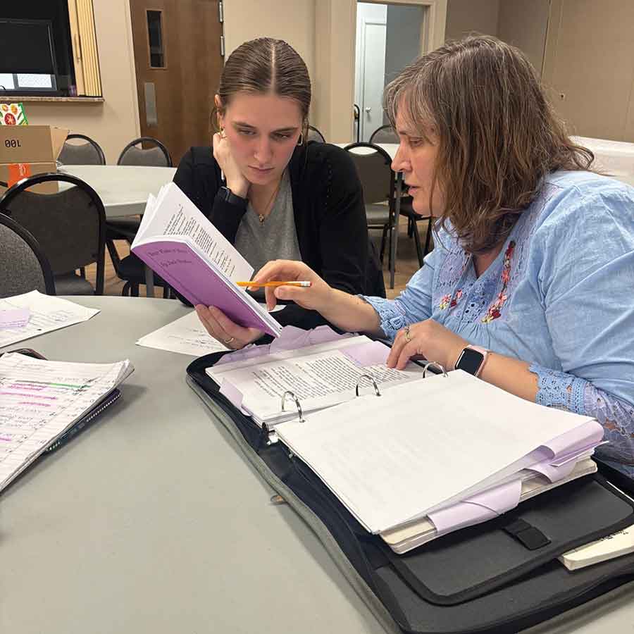 Shannon Dubé (right) reviews the script with her daughter during rehearsals