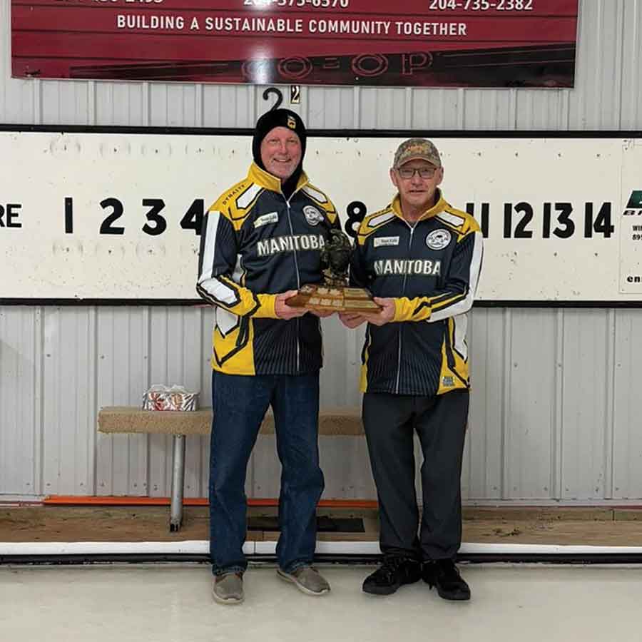 Ralph Nespor and Ross MacMillan show off their Team Manitoba gear before heading to the Stick Curling Nationals