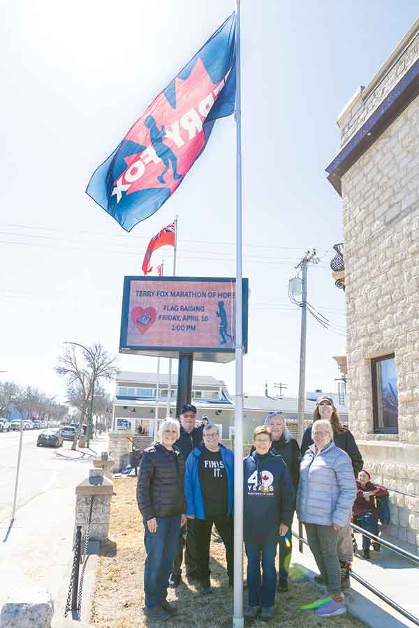 Stonewall Terry Fox Run committee members and supporters mark the start of the 2026 campaign with a flag raising ceremony outside the town office in Stonewall last Friday