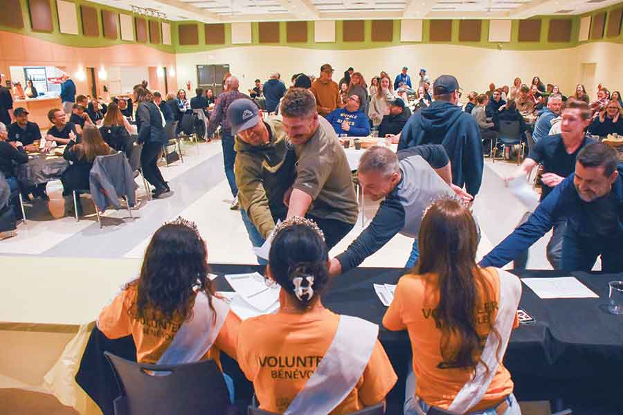 Teams rush to get their answers in first to the volunteering Sunflower Festival royalty