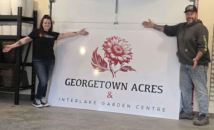 Rayme and Michelle Thomson unveil the new Georgetown Acres & Interlake Garden Centre signage, marking the start of a new chapter for the locally owned business in Winnipeg Beach