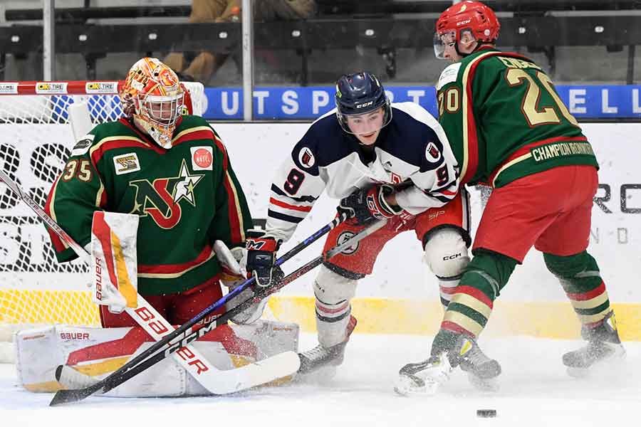 Ile des Chenes’ Justin Engel tries to stop Winkler’s Brett Bergman from getting to the puck in front of goaltender Matthew Radomsky in game five of the series last week. Winkler won it 6-2 and then took game six 4-3 two nights later on the road to win the trophy