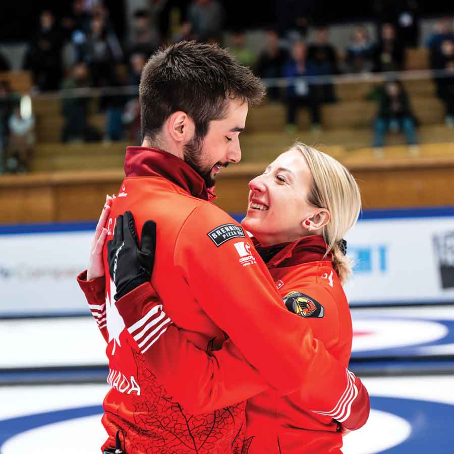 Colton Lott and Kadriana Lott share an embrace on the ice after securing Canada’s bronze medal