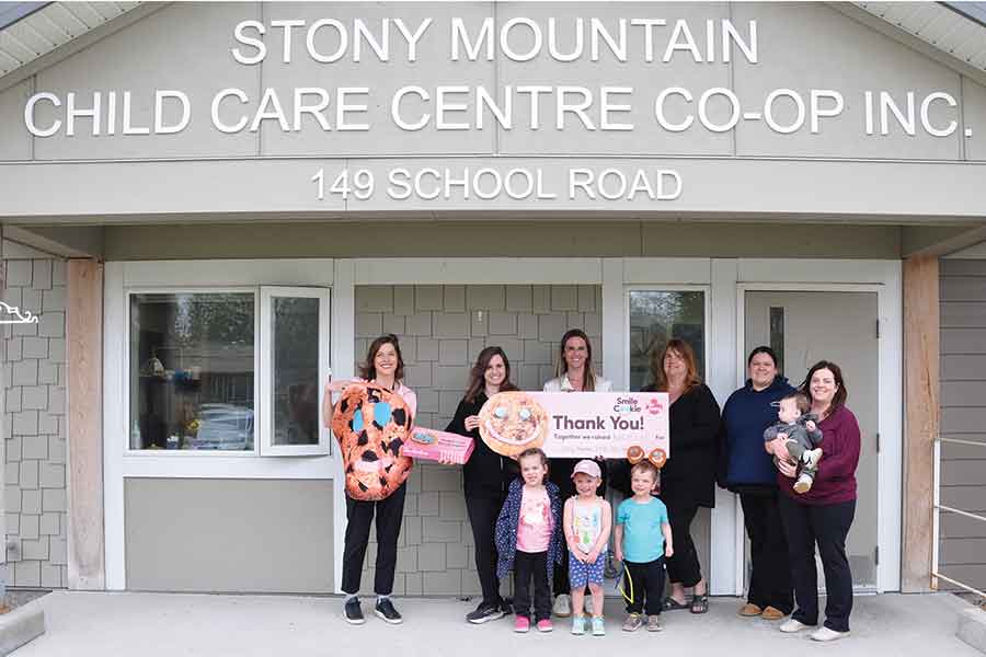 Representatives from the Stony Mountain Child Care Centre and local Tim Hortons locations celebrate the success of the 2026 Smile Cookie campaign,, which raised more than $25,000 to support daycare expansion and outdoor space improvements