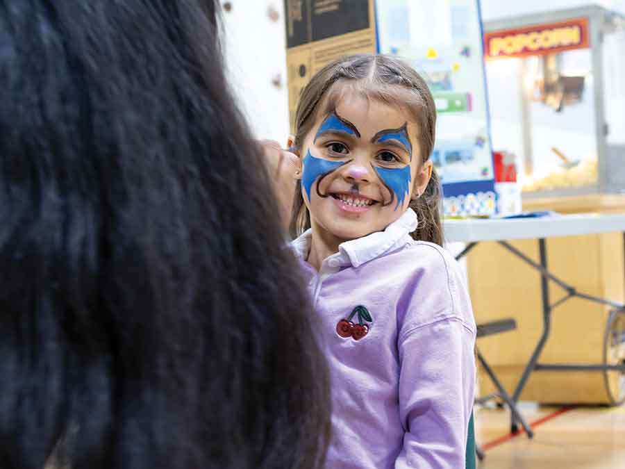 Maeve Kovac has her face painted