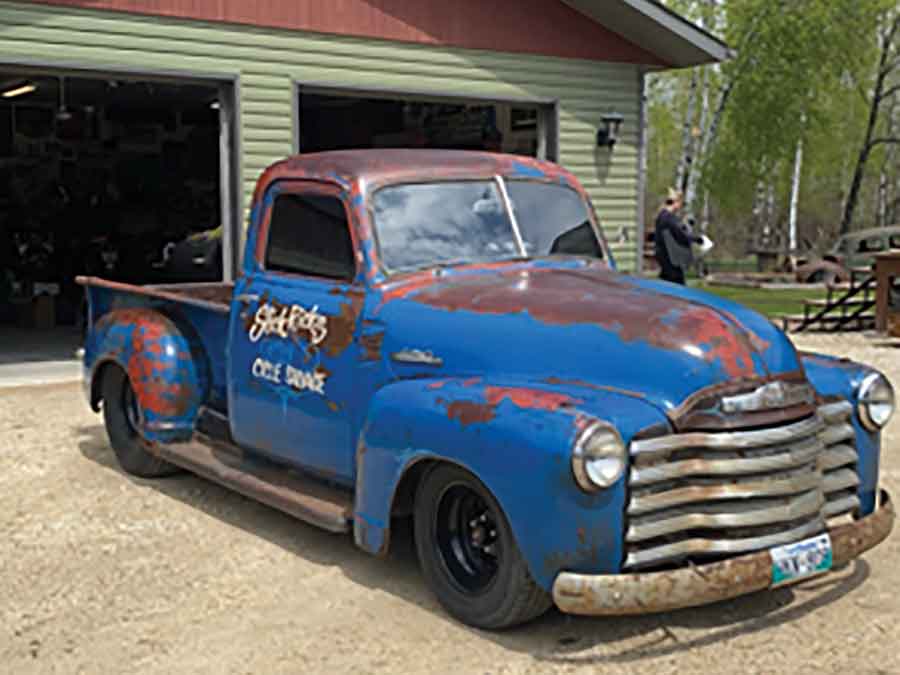 A 1950 Chevy pickup restored in a “rustoration” style blends modern upgrades with its original patina finish