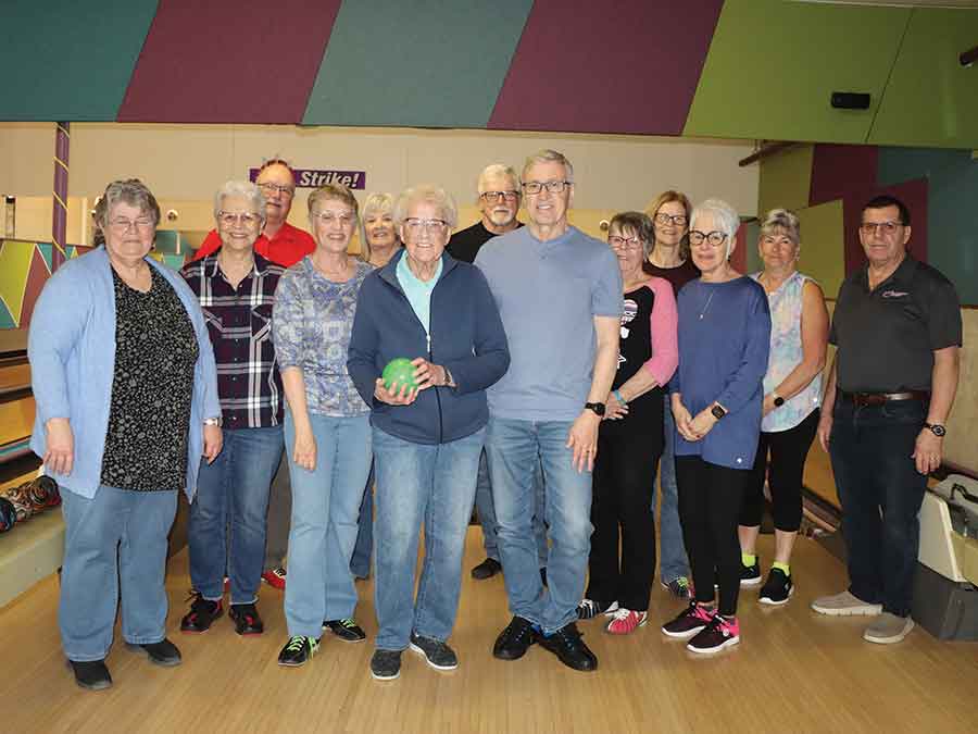 Anne Burton (centre) with her daughter Karen, to her left, and son Gary, to her right, as part of the regular Friday bowling group, where she continues to impress with her scores and love of the game