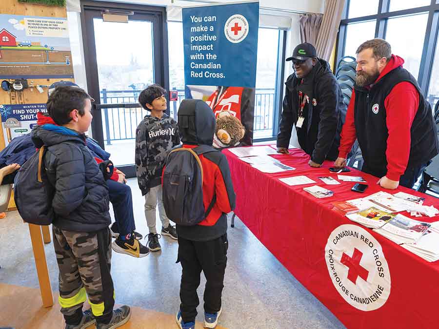Members of the Stonewall Cub Scouts stopped by the Canadian Red Cross station during the Emergency Preparedness Open House in Stonewall on May 4, where Emmanuel Opara and Christopher Plett shared information on how the Red Cross supports communities and families during emergency situations