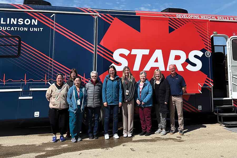 Carman Memorial Hospital staff stand in front with the STARS Mobile Education Unit during its visit on April 20. The specialized training unit travels across Manitoba to provide hands-on emergency simulations for rural health-care providers