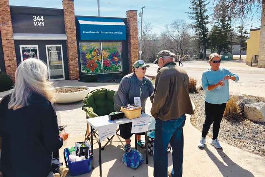 Gwen Sharp, Nav-CARE coordinator hands out water and snacks at the halfway point courtesy of Tracey Malone owner of Inview Insurance