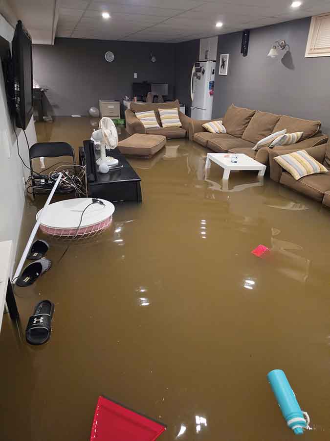 Floodwaters left a trail of destruction in the basement of Chris and Corinne Lothian’s Stonewall home, damaging furniture, electronics, appliances and irreplaceable family mementos. The family estimates the storm caused more than $90,000 in damage