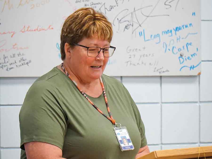 Alf Cuthbert School principal Alann Fraser emcees the afternoon program and shares a letter from former director of student services Annette Holowka