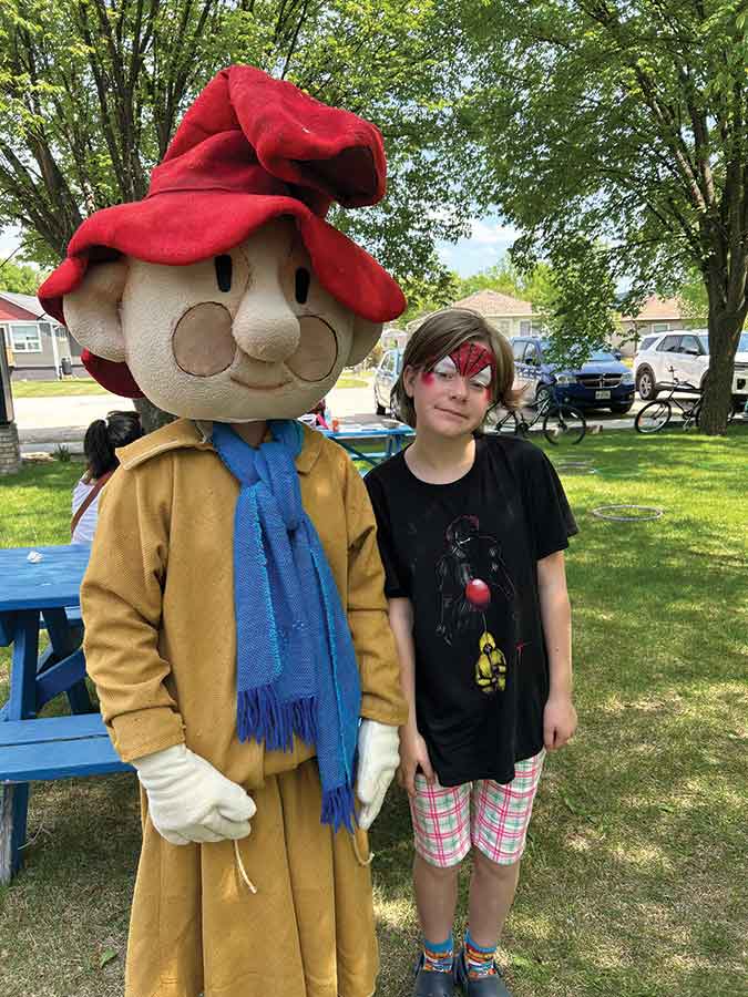 Anna Palson poses with one of Gimli’s beloved Huldufolk during a magical picnic hosted by the hidden people at the RM of Gimli administration building on June 14