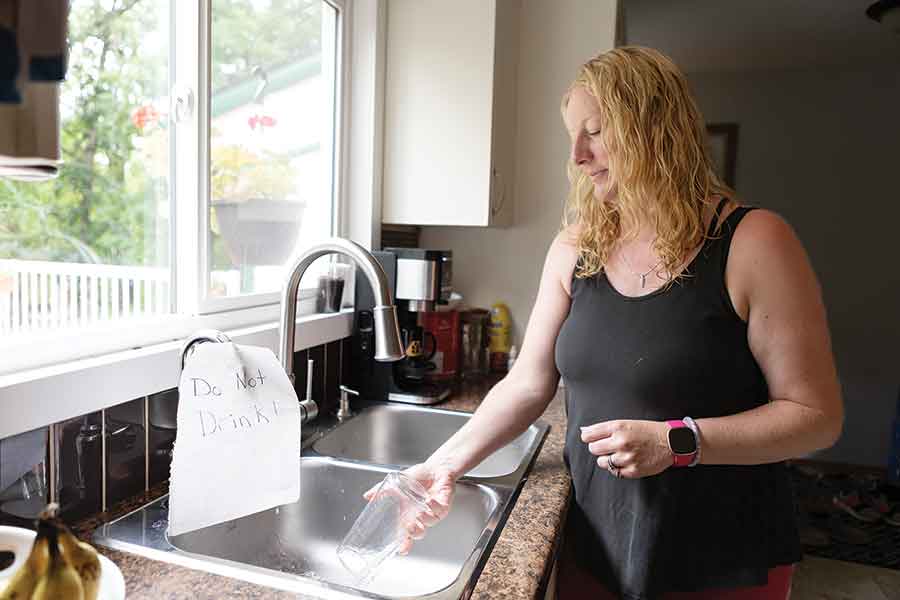 Candace MacMillan dumps a glass of water at her Rockwood-area home after laboratory testing revealed E. coli contamination in her family’s well following recent flooding. Although the water looked, tasted and smelled normal, MacMillan is encouraging other rural residents with private wells to have their water tested if flooding occurred on or near their properties