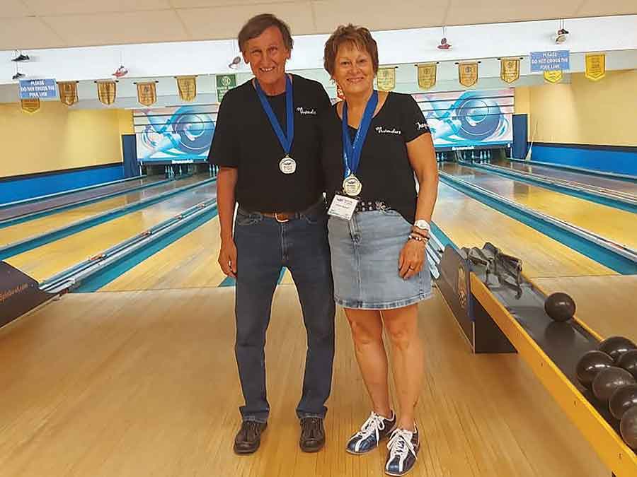 David Dyck, left, earned silver in the men’s singles competition while Jacquie Russell captured gold in the women’s singles division during five-pin bowling competition at the Manitoba 55+ Games in Carman