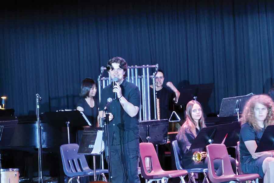 Carman Collegiate band students perform during the school’s annual Art Appreciation Evening on June 11. The concert complemented the student art showcase, which featured artwork from Grades 6 to 12 displayed throughout the school’s hallways. Left photo, Jack Knight, graduating band student, singing “I Did it My Way”