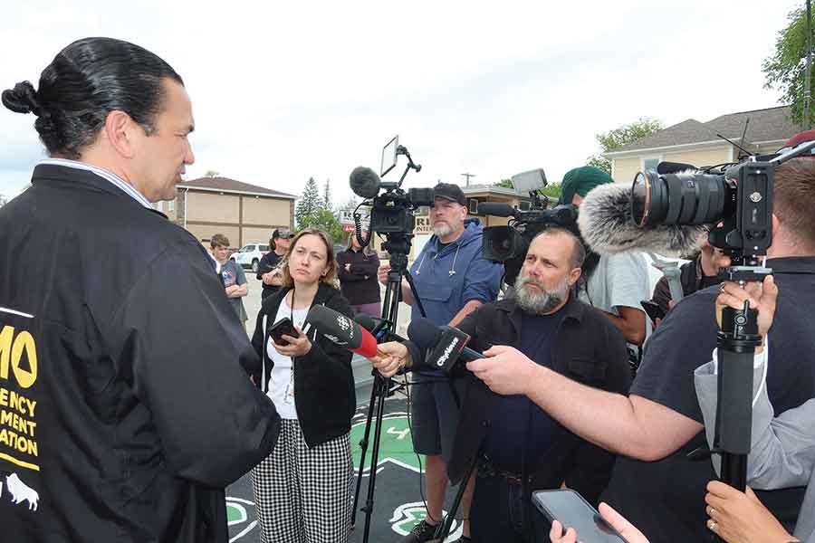Manitoba Premier Wab Kinew speaks with reporters in Stonewall on June 11 after announcing a provincewide Disaster Financial Assistance program to help residents, businesses and municipalities recover from flooding caused by record rainfall earlier in the week