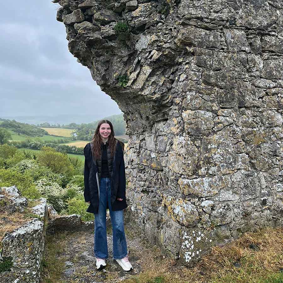 Scarlett Friesen overlooks the Irish countryside from the Rock of Dunamase, a historic castle ruin that provided panoramic views