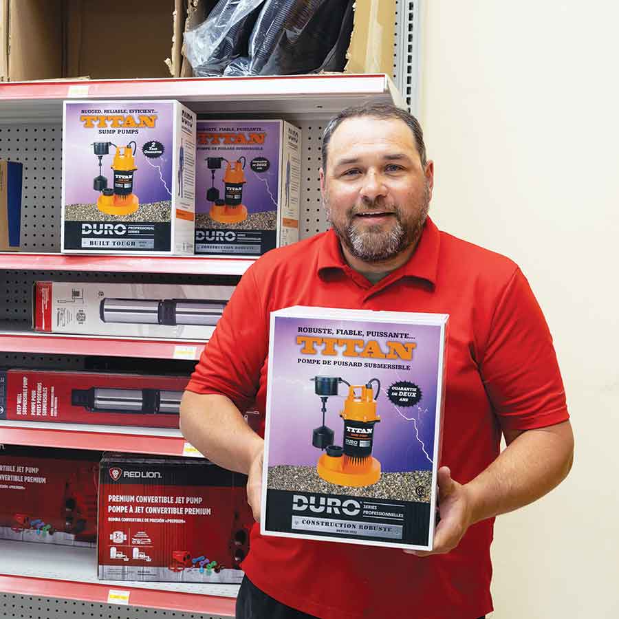 Andrew Kirk of Stonewall Home Hardware holds one of the sump pumps that quickly sold out as residents scrambled to protect their homes during the historic June 9-10 storm. Kirk and staff kept the store open until midnight to provide pumps, hoses and fittings to residents dealing with rapidly rising floodwaters