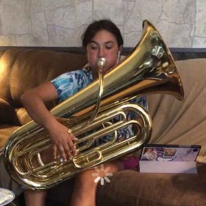 Josie is a grade 8 student who plays the tuba. She was recognized at the festival for being one of the few tuba players
