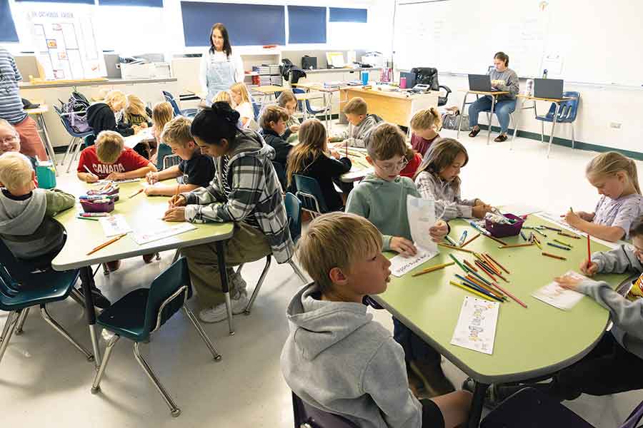 Stony Mountain kindergarten to Grade 2 students share a classroom with tables and chairs borrowed from École R.W. Bobby Bend School