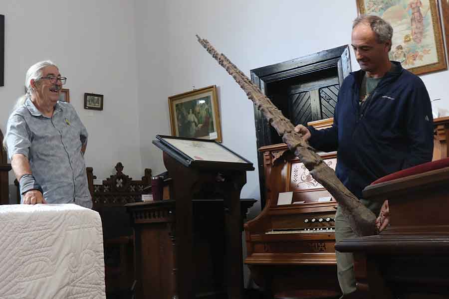 Miami Museum president Joe Brown (left) with Canadian Fossil Discovery Centre executive director Adolfo Cuetara and one of the large fossils the museum has in its collection