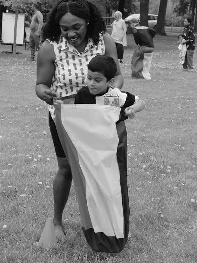 Participants at Regional Connections’ “Play It Forward” event in Morden Park Saturday, where volunteers collected donations for the local food bank and organized a host of friendly competitions, including potato sack races