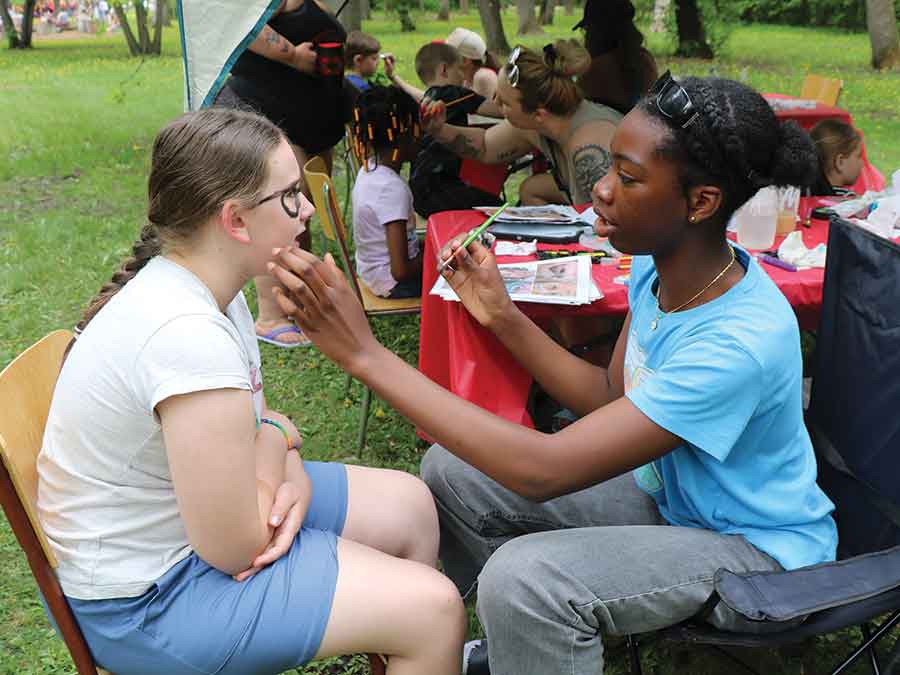 The face painting tables were a popular place