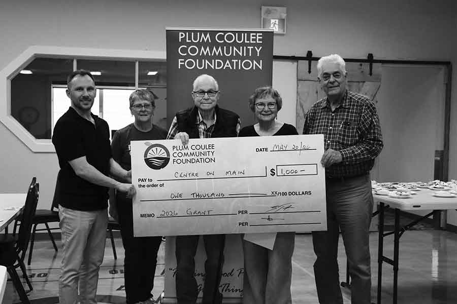 Taylor and board member Moira Porte presented The Centre on Main reps Brian Derksen, Dorothy Derksen, and Allen Funk with funds for facility improvements