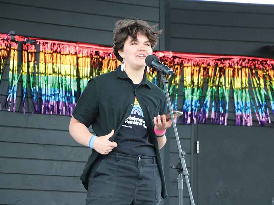 The 2SLGBTQIA+ community came together for the first time in Winkler Saturday to hold a march and rally in celebration of June as Pride Month. Left photo, Carman’s Jack Knight shares what seeing Pride celebrations taking place in their communities means to them