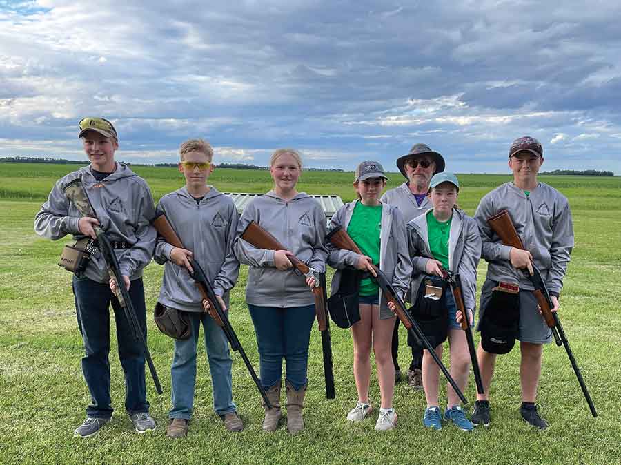 Members of the Pembina Triangle Trap Club who competed at the provincial championships, left to right, Travis Giesbrecht, Kevin Giesbrecht, Karissa Giesbrecht, Addy Shepherd, Kevin Brown (coach), Bella Orchard and Alex Orchard. Missing from the photo is Rob Wiebe