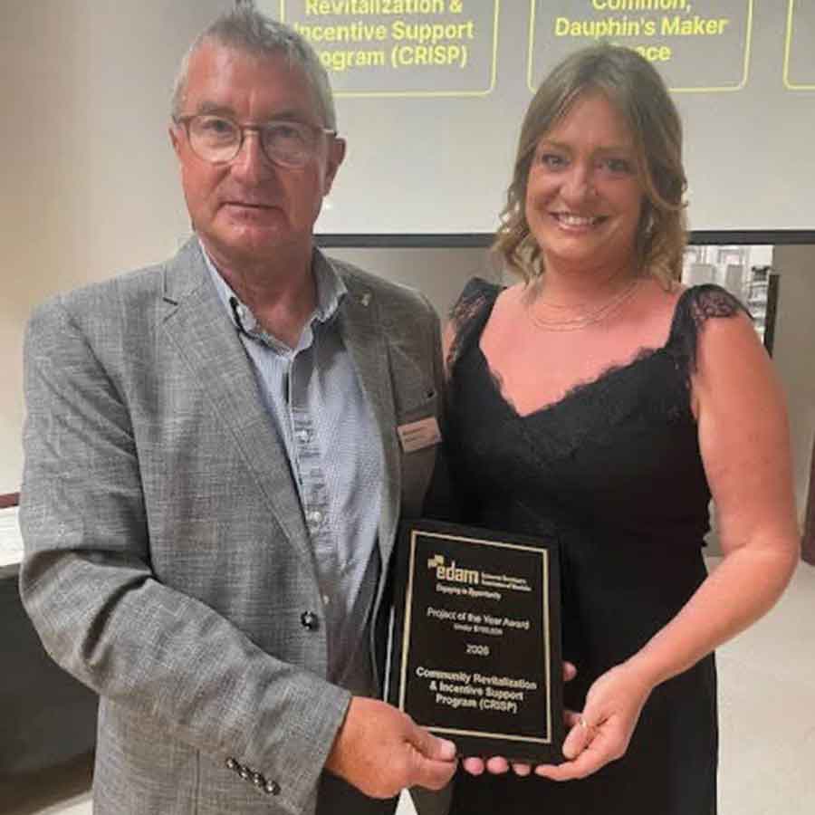 Town of Stonewall Economic and Tourism Development Officer Brittany Isfeld accepts the Project of the Year Award for the Town’s Community Revitalization & Incentive Support Program (CRISP) at the Economic Developers Association of Manitoba Awards Gala on June 12
