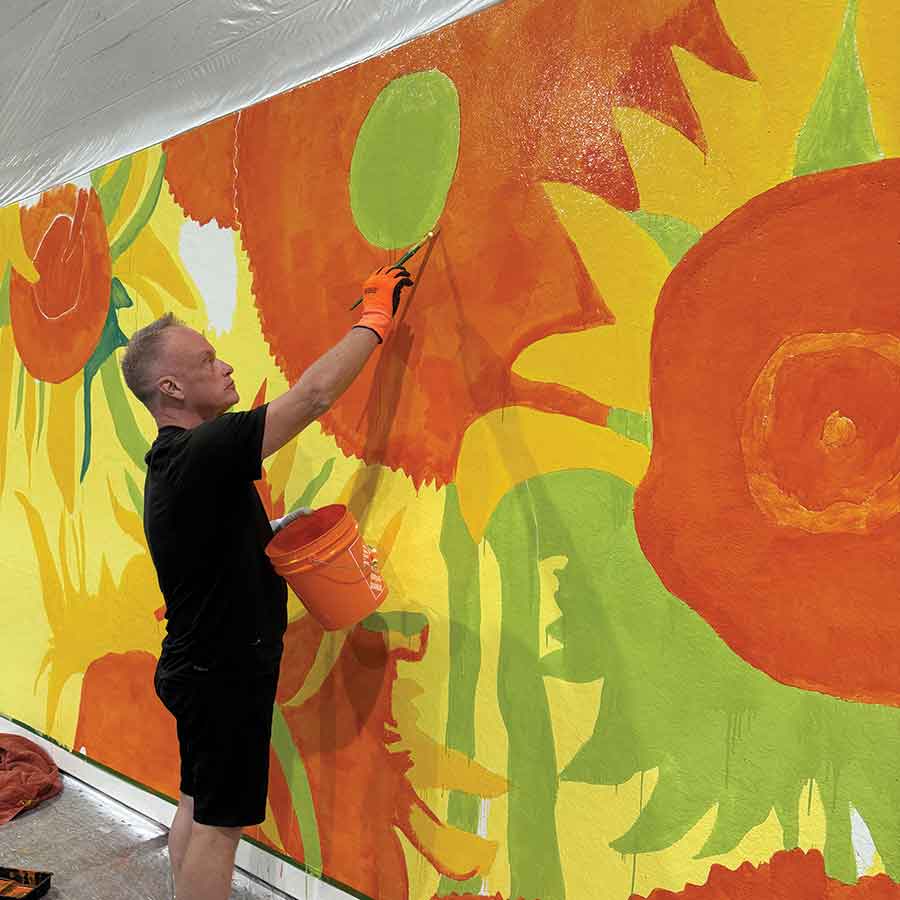 Cameron Cross has been busy in Altona in recent weeks painting the new and improved giant Van Gogh “Sunflowers” painting, which the town hopes to have back up on its easel in time for the Manitoba Sunflower Festival this month