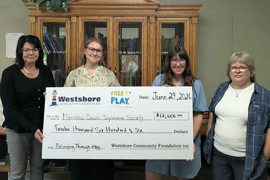 The Manitoba Down Syndrome Society receives a $12,606 Free to Play grant from the WCF to install playground communication boards at schools in Riverton, Gimli and Winnipeg Beach. Pictured, Sandra Davies, Jubilee Dueck-Thiessen (Manitoba Down Syndrome Society executive director), Romanna Klymkiw and Mavis Lewis-Webber